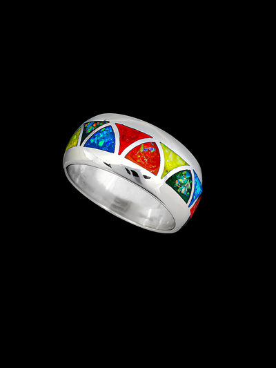 Wolvestuff's Wide Band Rainbow Pride Triangles Ring, handcrafted in sterling silver is inlaid with red, orange, yellow, green, and blue opals in a rainbow pattern
